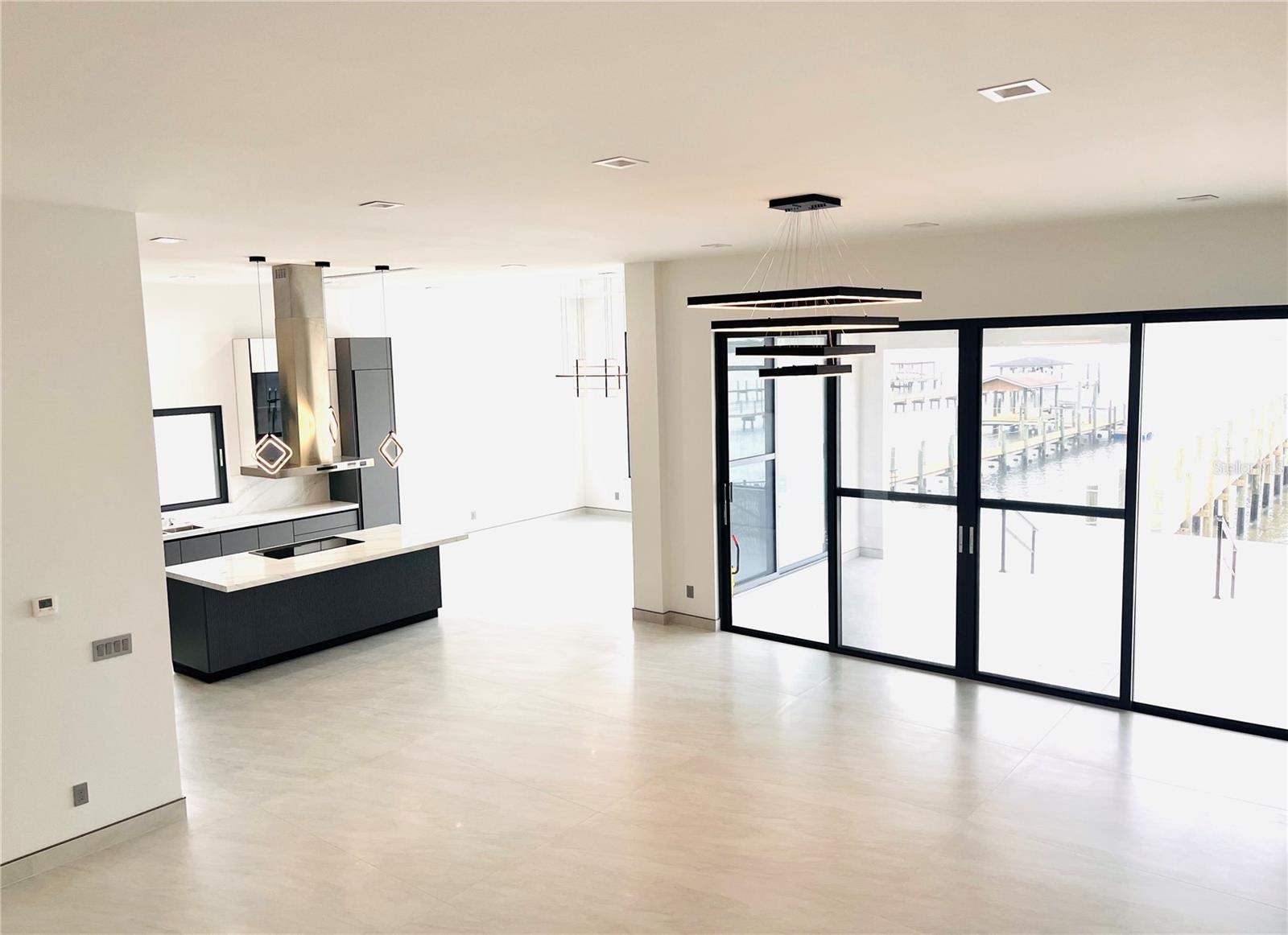 GREAT ROOM VIEW INTO KITCHEN AND DINING AREA