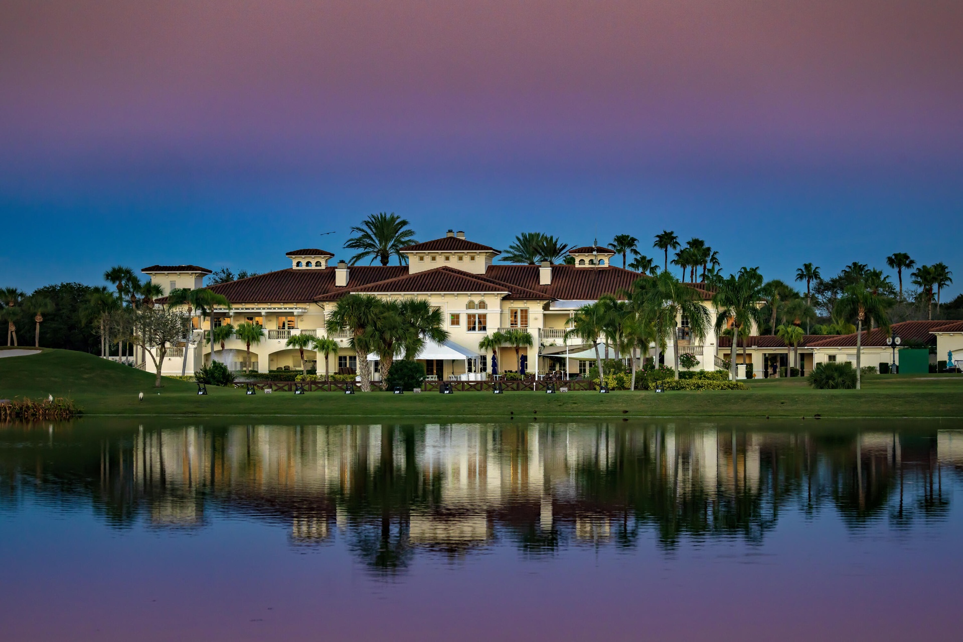 The elegant Grand Harbor main clubhouse serves as the community's social heart, offering premier dining experiences and a fully appointed pro shop.