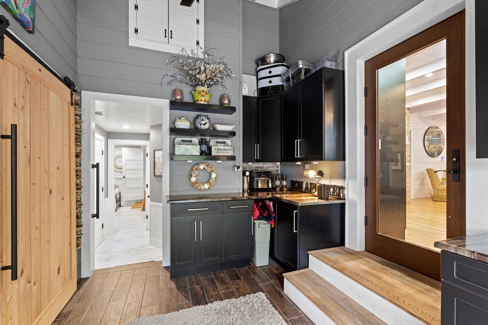 Step-down pantry area, w counters, and storage.