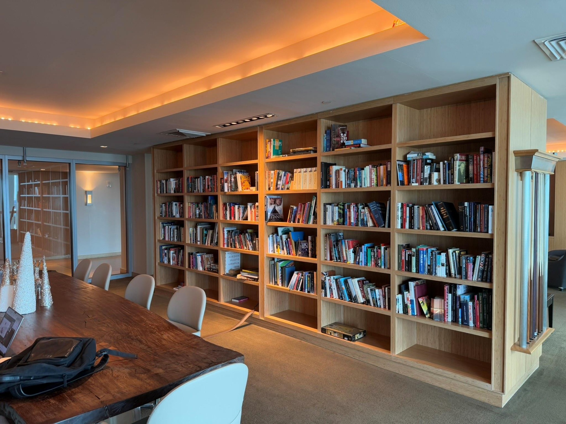 Custom built-in wood shelving featuring extensive storage