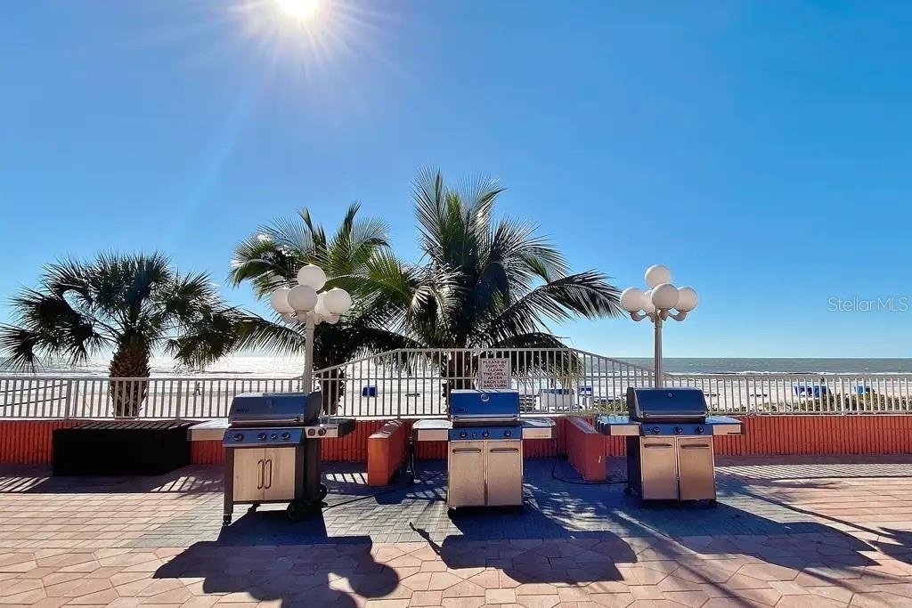 GAS GRILLS LOCATED ON POOL DECK, PERFECT FOR PREPARING AND ENJOYING  MEALS WITH BREATHTAKING BEACH VIEWS.