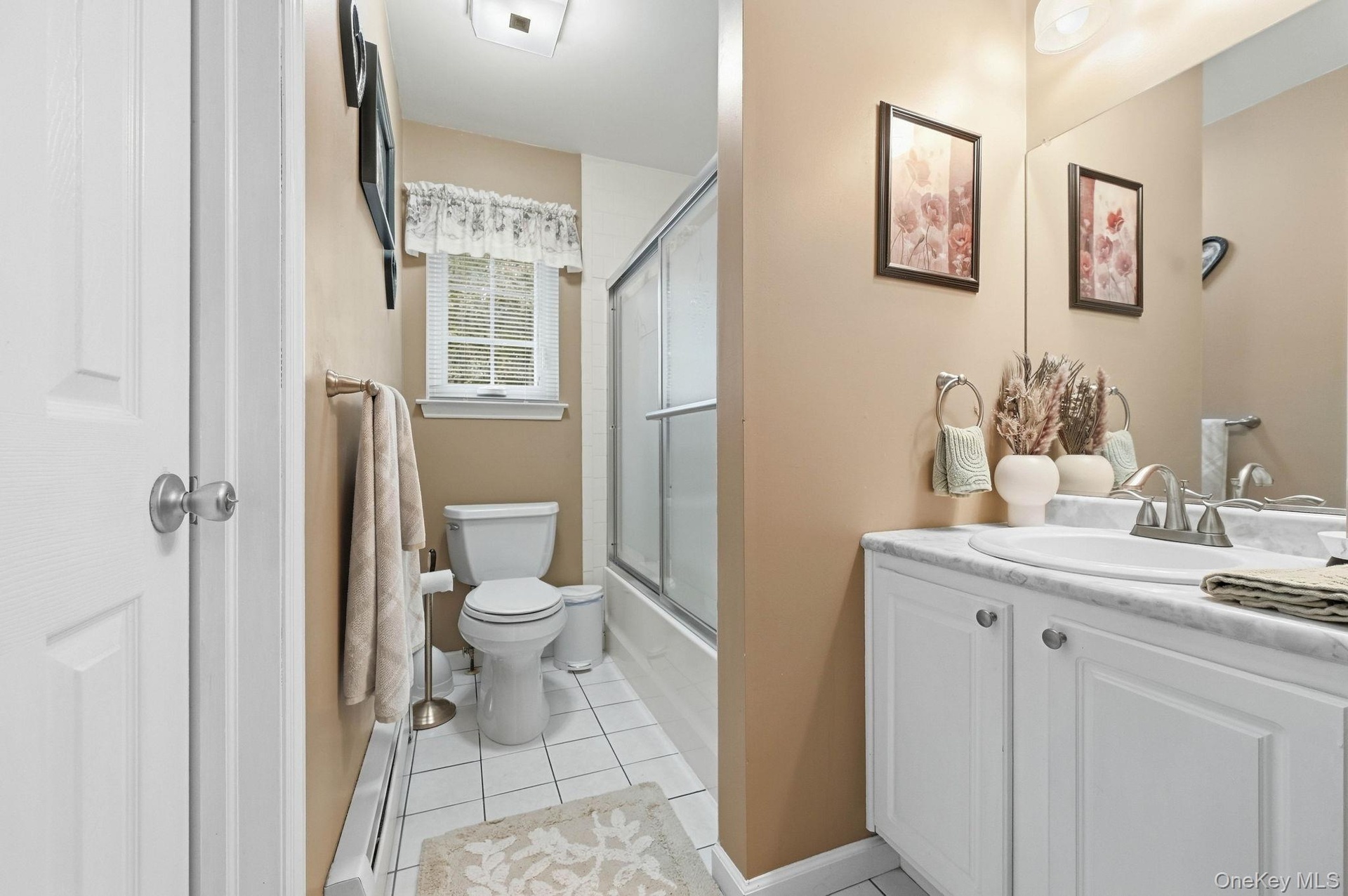 A second full bathroom adds convenience to the home's three-bedroom layout.