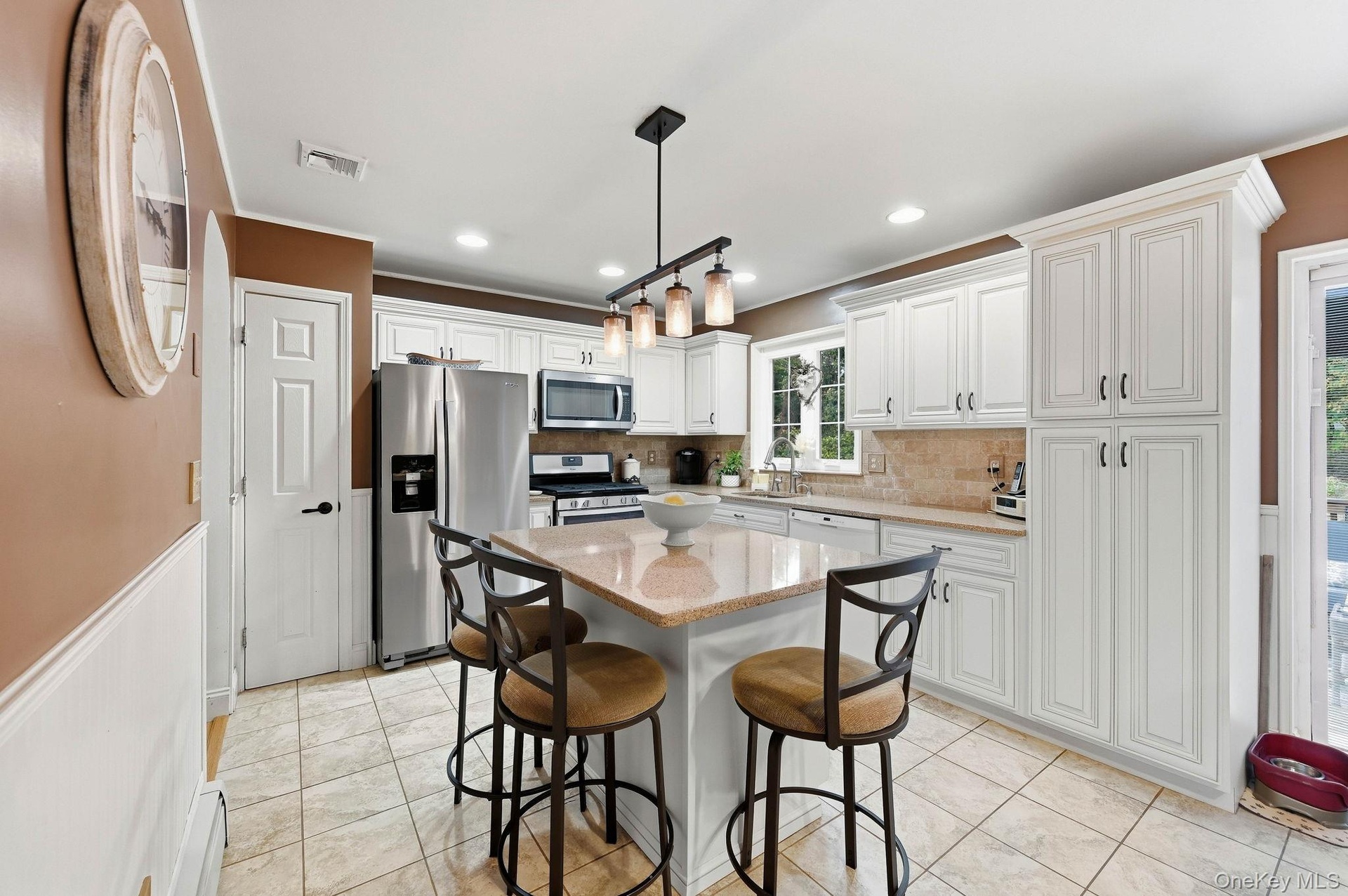 Thoughtfully designed cabinetry and counter space make this kitchen ideal for everyday cooking and entertaining.