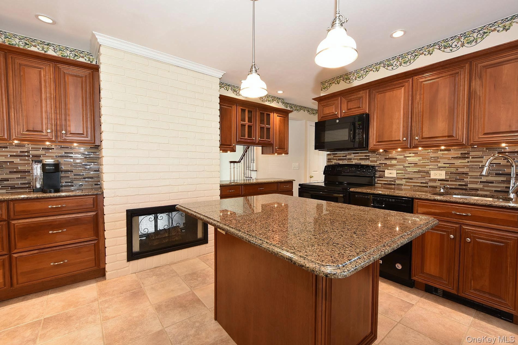Kitchen with an Island & Double Sided Fireplace