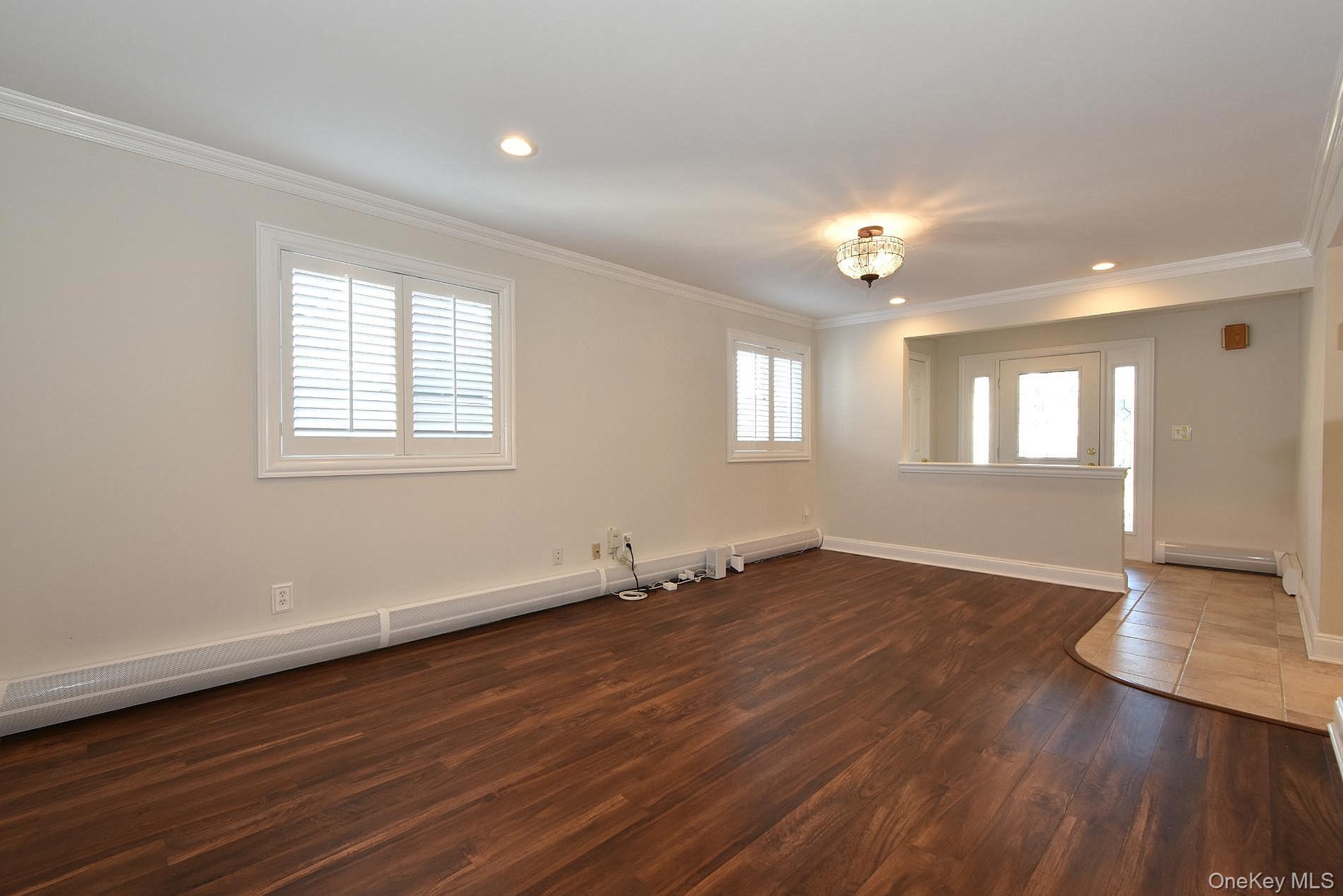 Entry Foyer & Living Room with plantation shutters