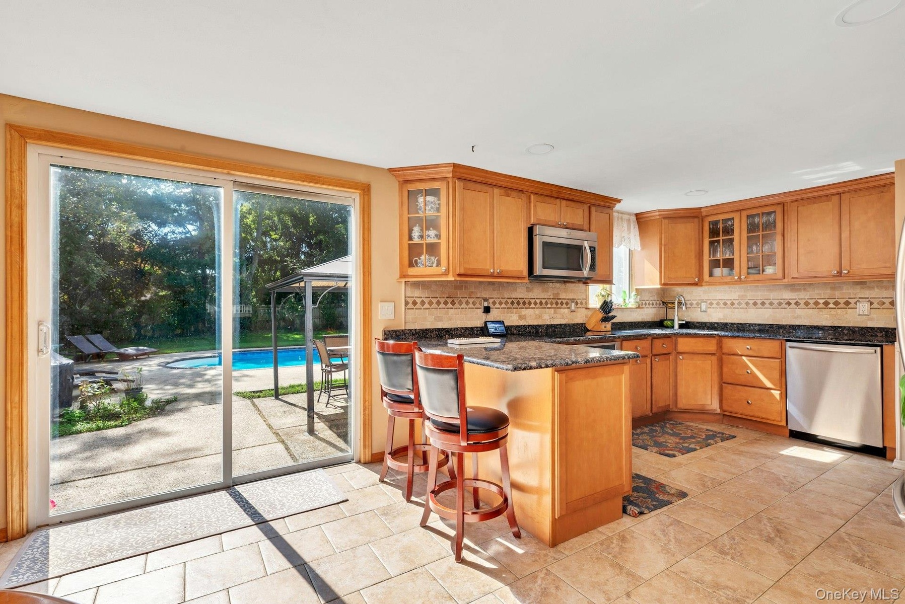 View of kitchen looking into backyard