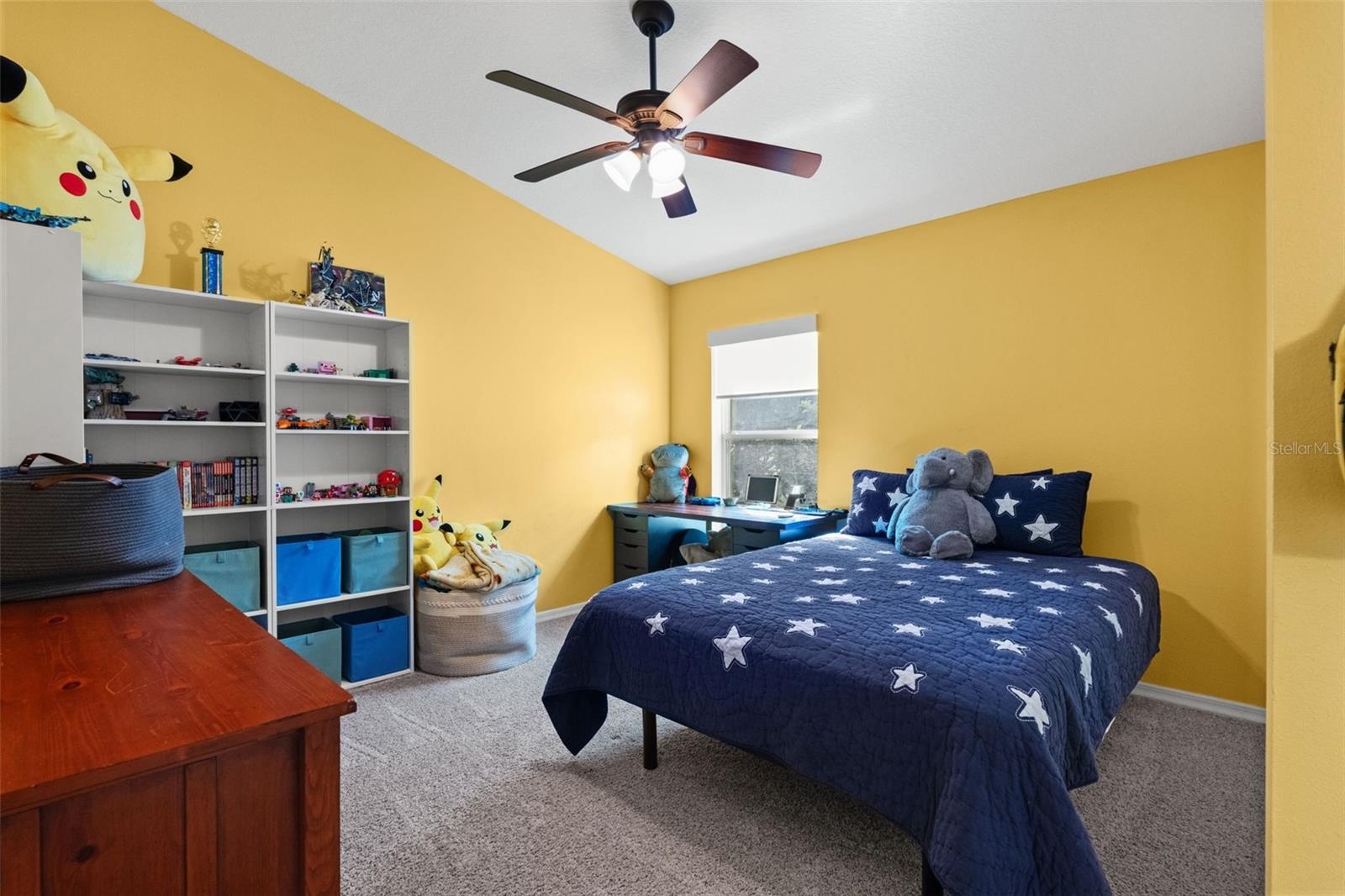 Another spacious secondary bedroom offers plenty of room for a full furniture arrangement and personal touches.