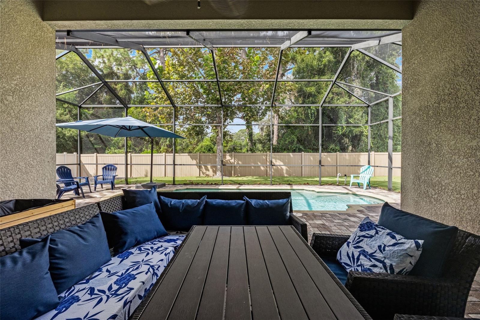 There’s plenty of room under cover for outdoor dining and lounging, creating a true extension of the home’s living space.