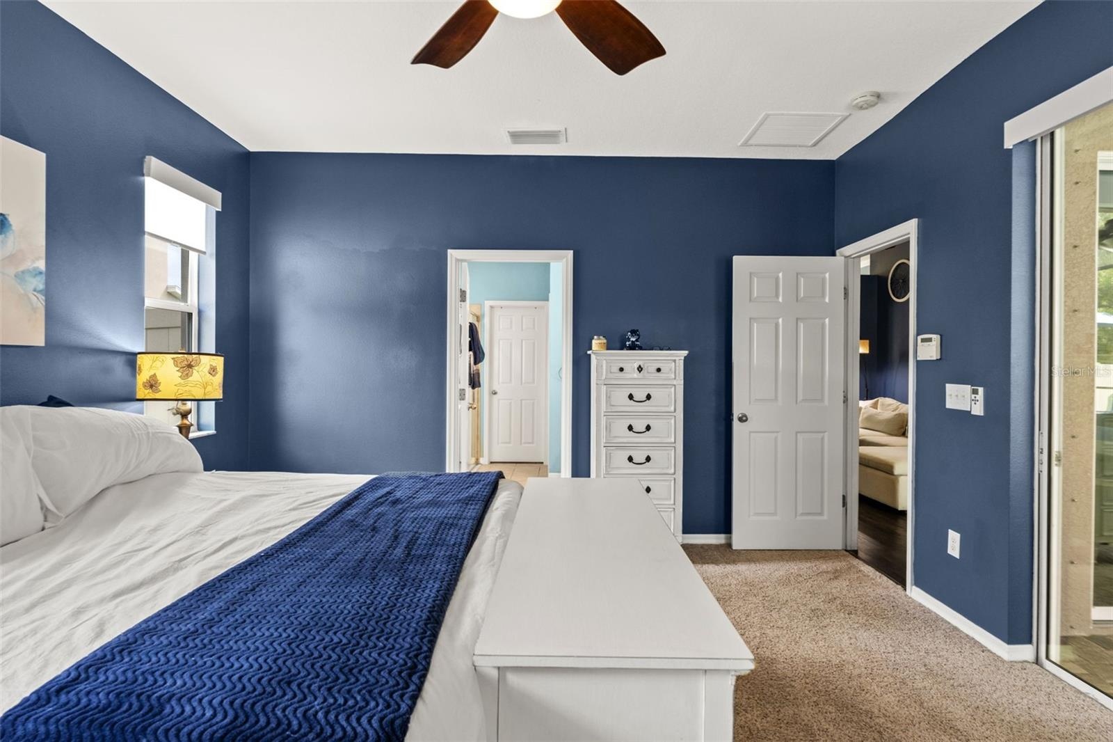 Tucked into the split-bedroom floor plan, the primary suite creates a private retreat away from the secondary bedrooms.