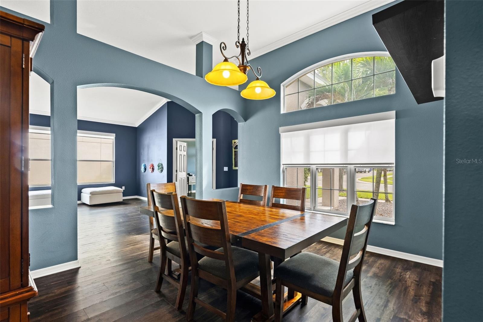 Open sightlines between the dining and living areas make the floor plan feel spacious without sacrificing defined rooms.