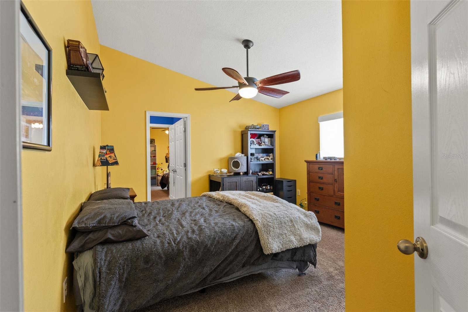One of four bedrooms, this generously sized room offers flexibility for family, guests, or additional work-from-home space.