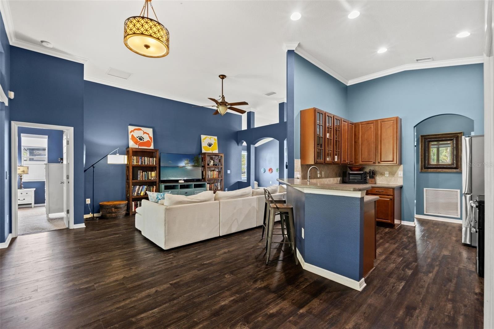 This open-concept hub brings the kitchen, family room, and outdoor living areas together for an easy Florida lifestyle.