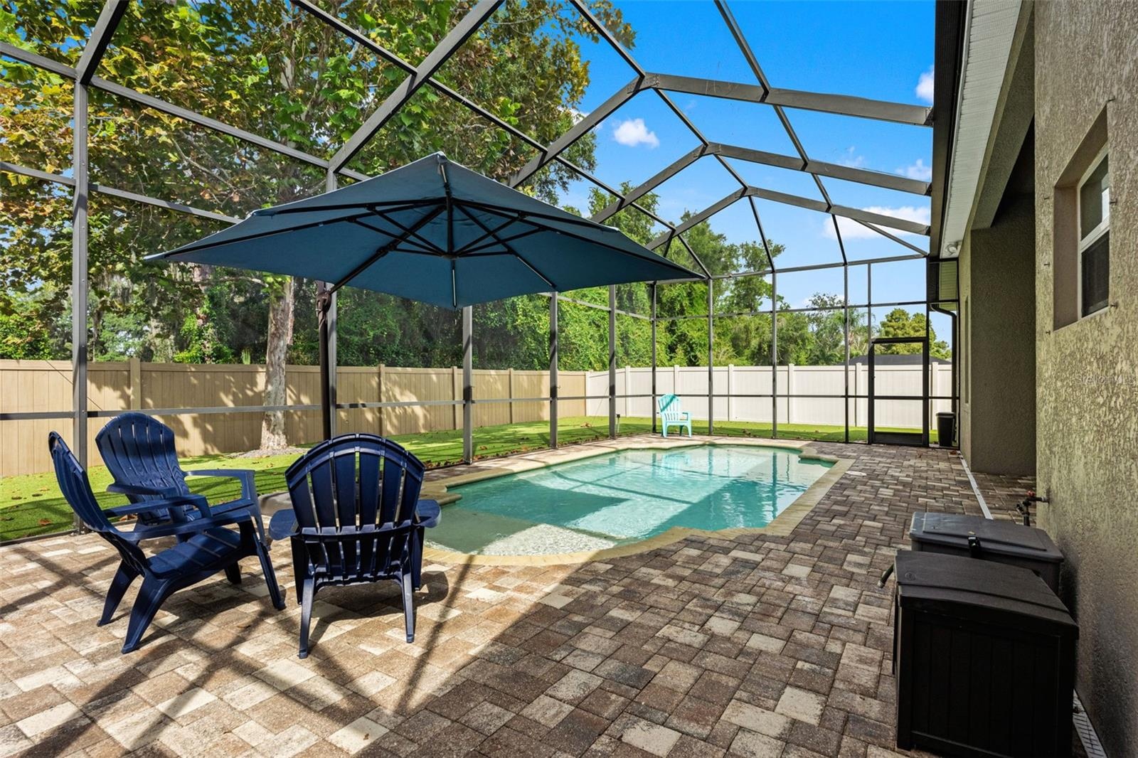 The pool deck offers multiple places to gather, whether you’re hosting friends or enjoying a quiet afternoon at home.