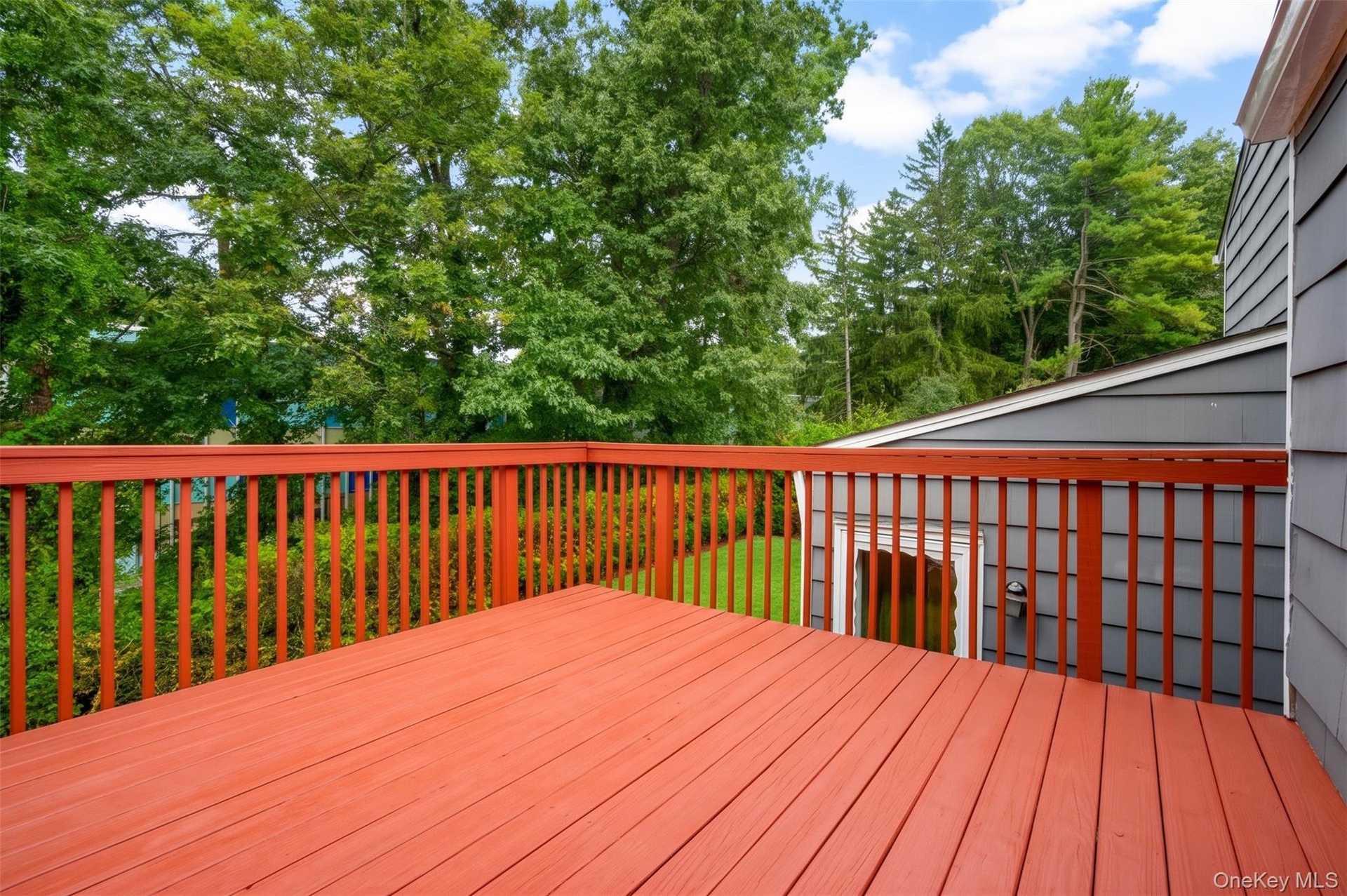 Kitchen door to the deck makes kitchen-level grilling, al fresco dining...