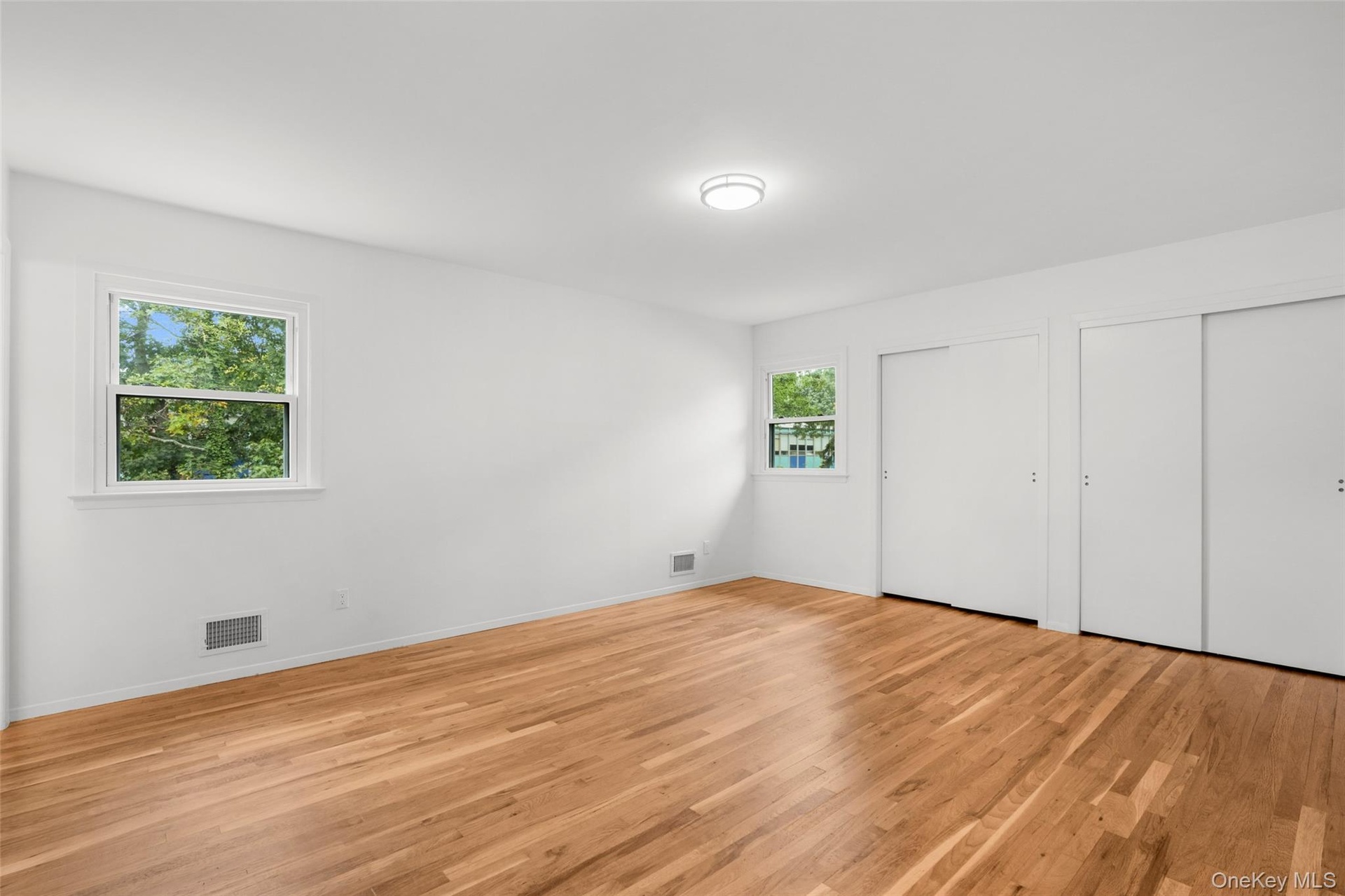 A restful primary suite with dual closets.
