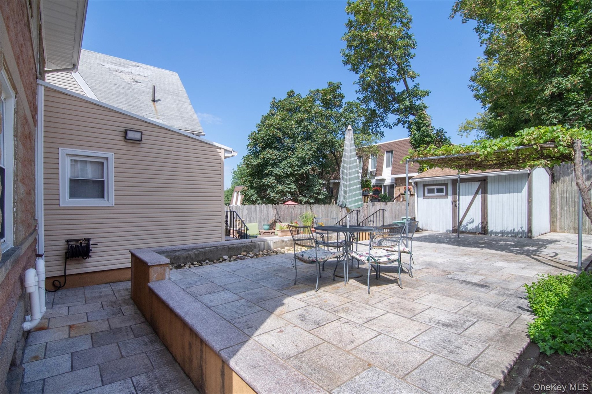 Upper Patio with sizeable Shed in Back ground