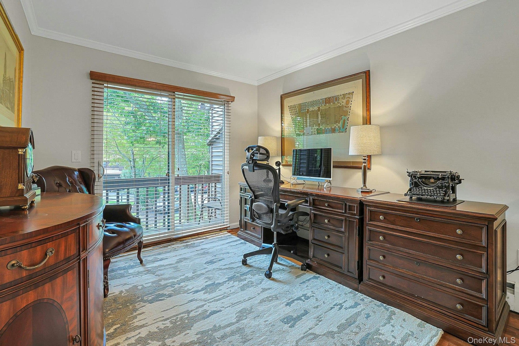 Loft area used as an office has SGD to balcony.