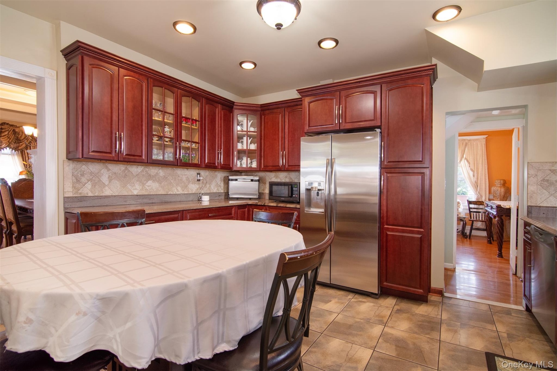 Eat-in-Kitchen stainless steel appliances and recessed lighting