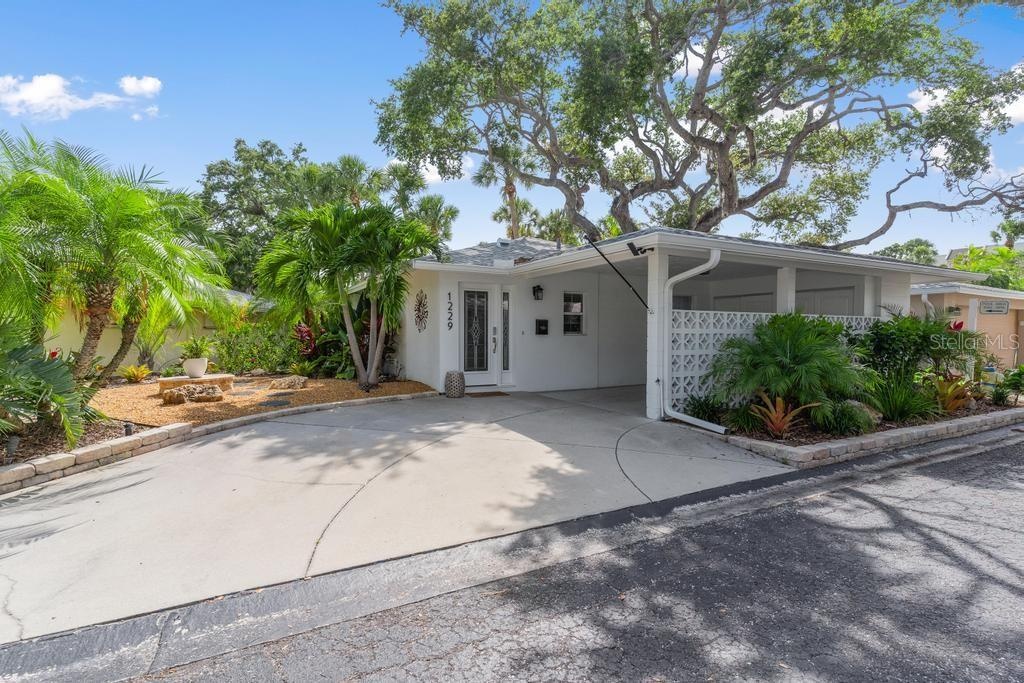 Covered Carport and Driveway accommodates up to 3 Vehicles