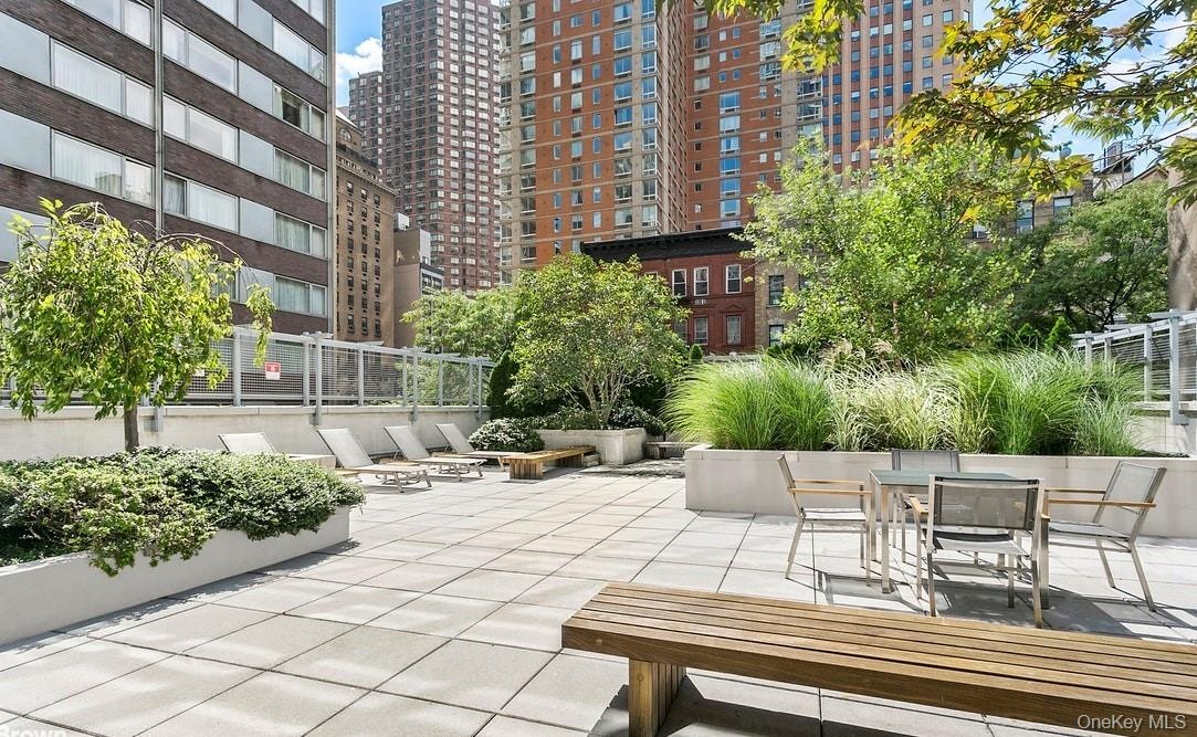 View of patio with a city view