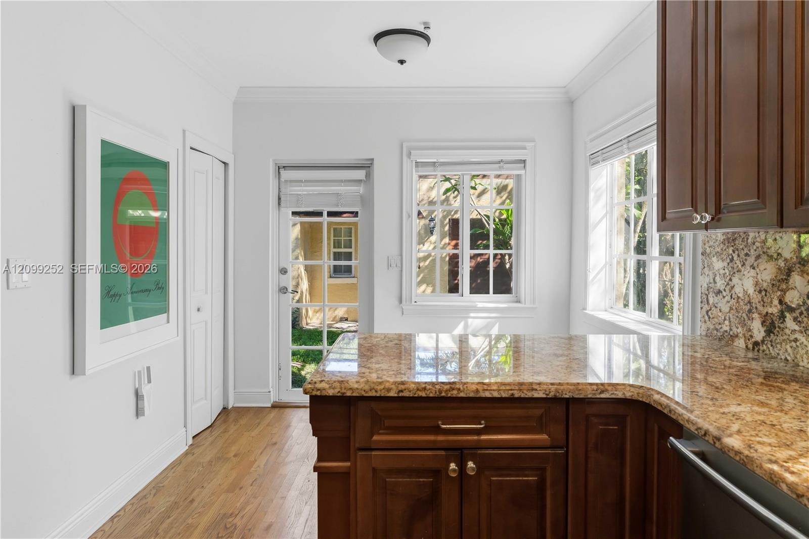 Kitchen offers space for breakfast nook and convenient laundry closet