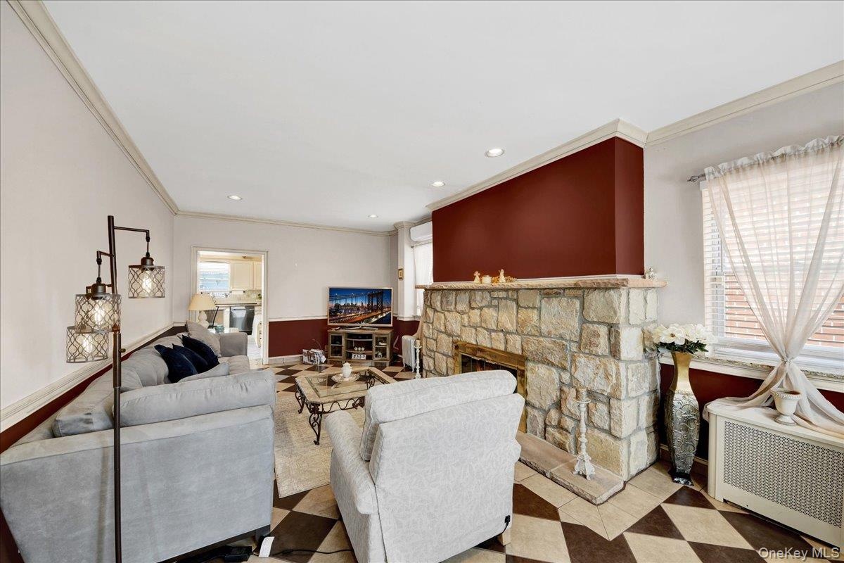 Spacious and bright living room with stone wood burning fireplace