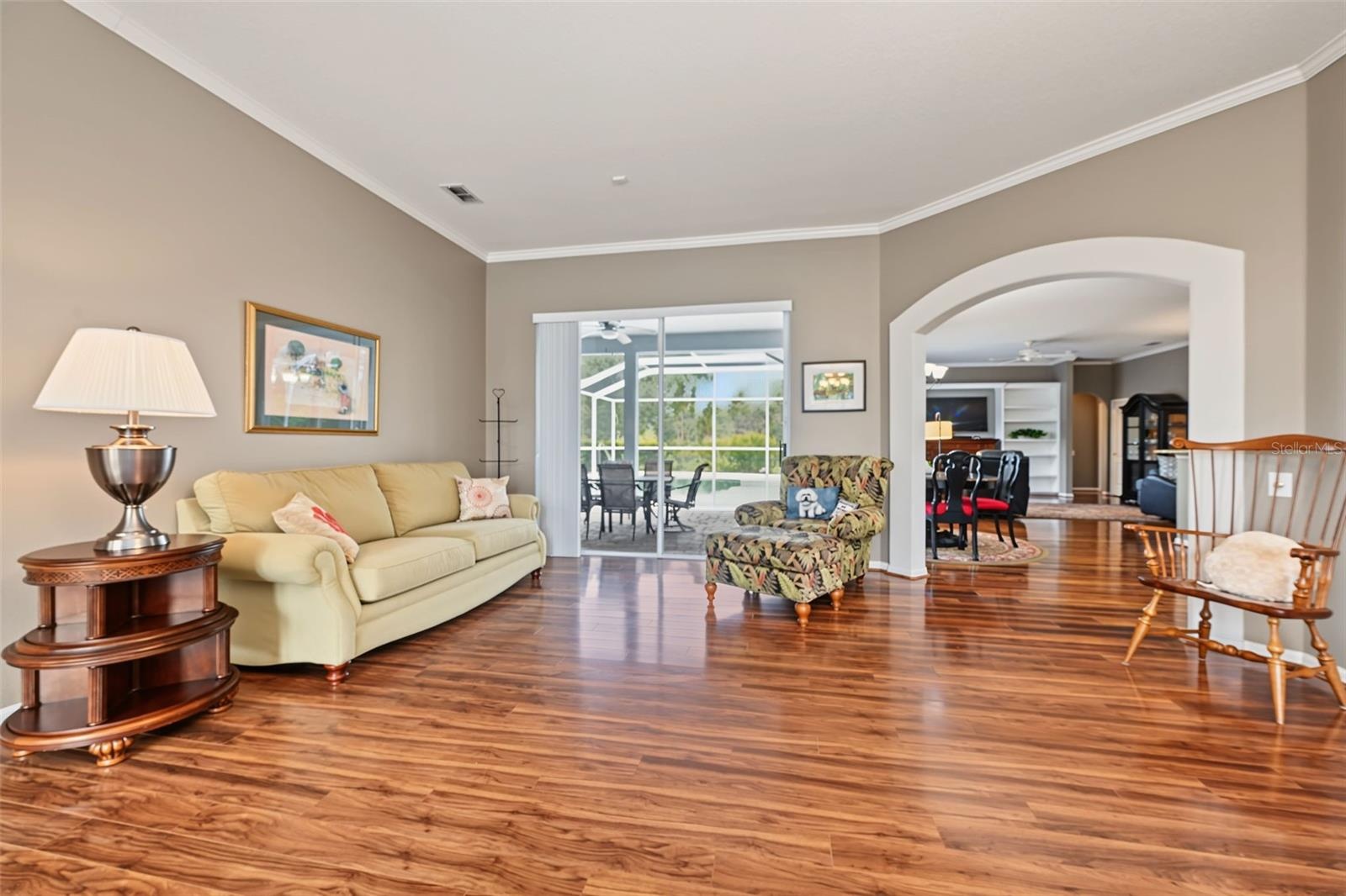 Formal living room with sliders to lanai/pool area