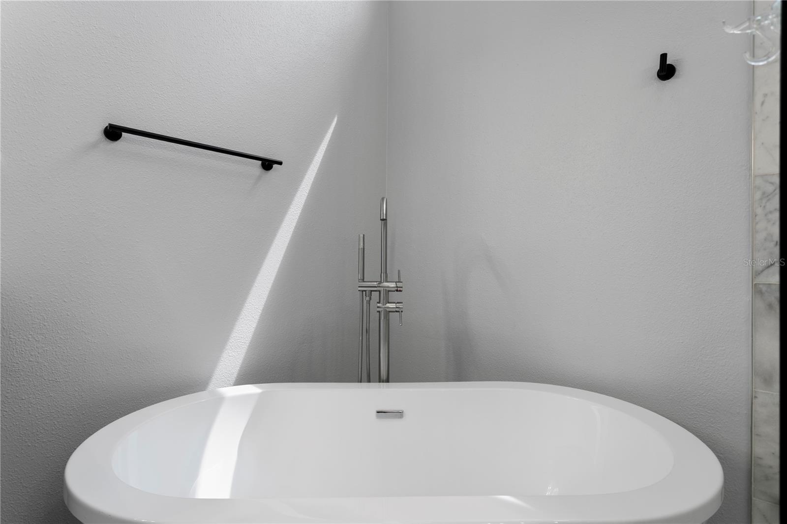 Unwind in the inviting freestanding soaking tub