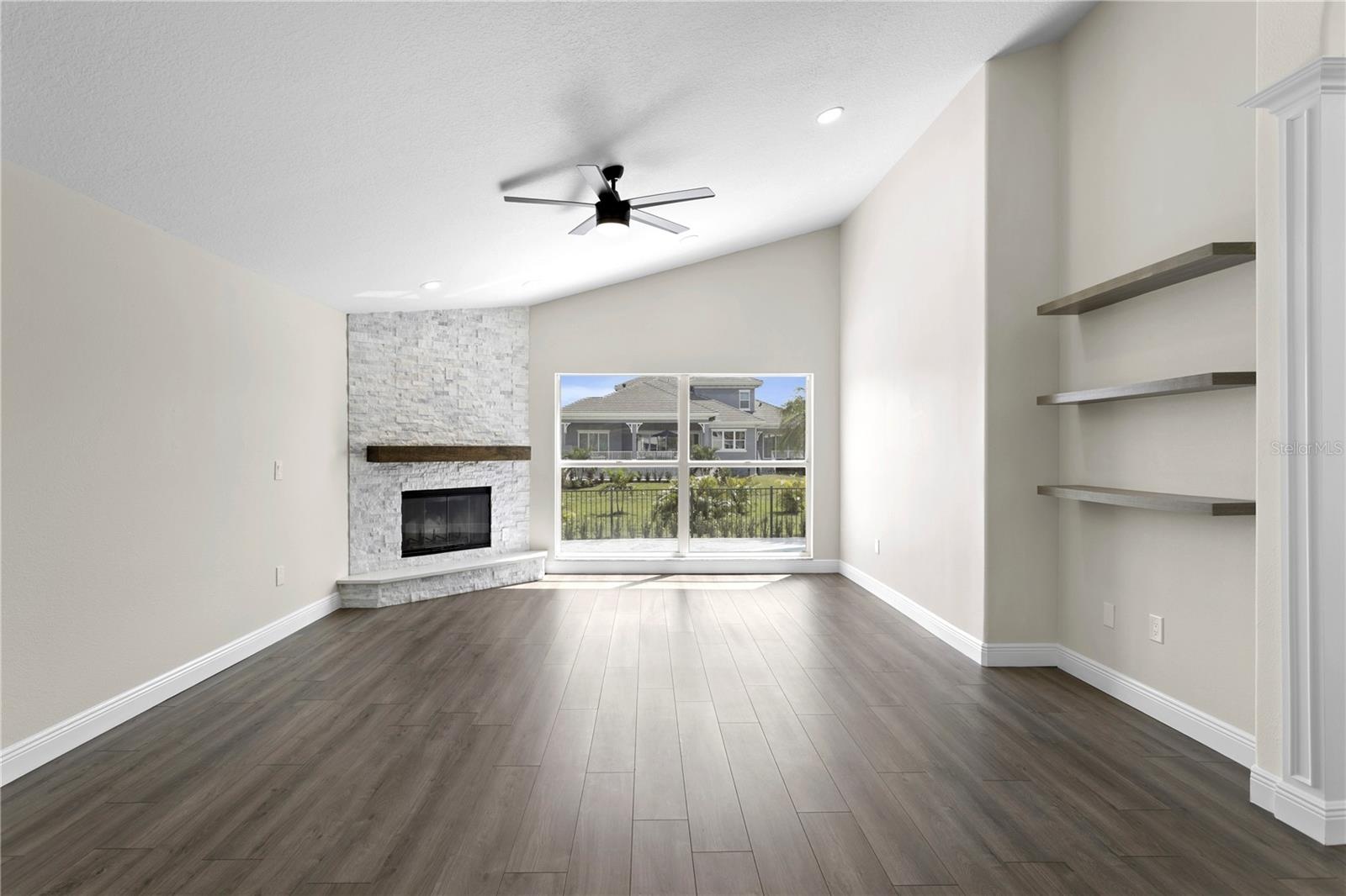 The spacious family room opens to the kitchen and additional living spaces, creating an ideal flow for everyday living and entertaining.