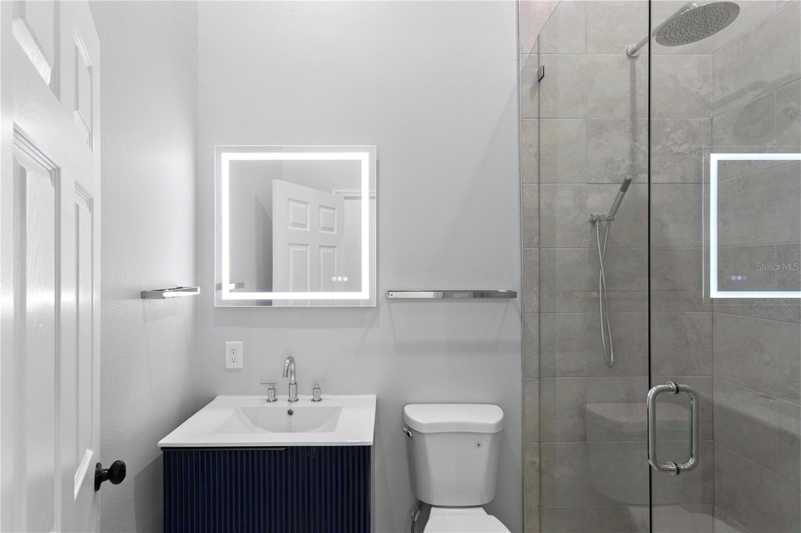 This elegantly appointed hall bath conveniently serves 2 of the bedrooms.