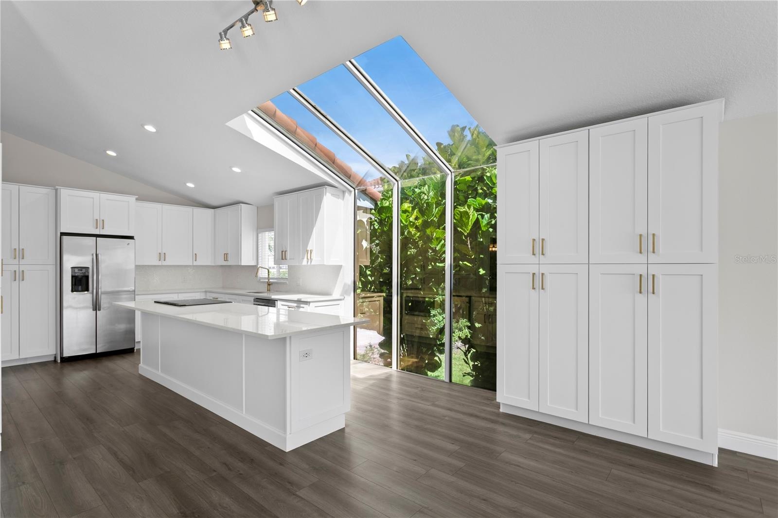 This gorgeous kitchen features stainless steel appliances (new in 2020) and stunning quartz countertops.