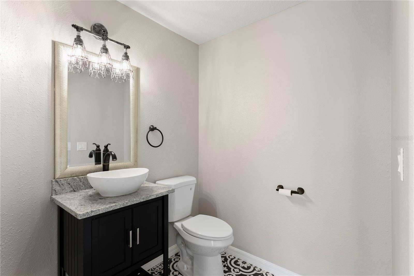 Beautifully appointed powder room with elevated finishes