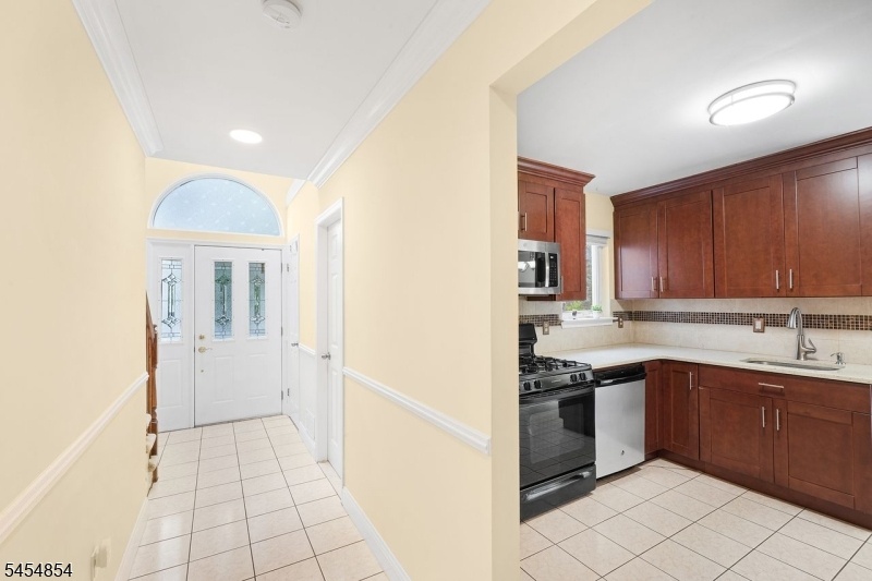 Inviting 1st Floor Tile Foyer