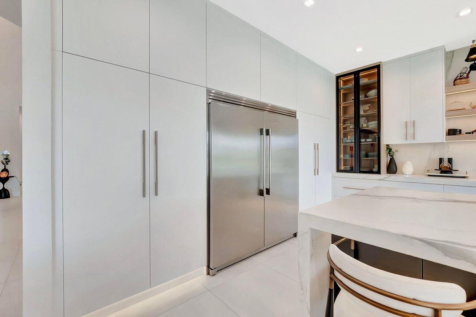 Seamlessly integrated refrigeration and custom cabinetry designed for a clean, modern aesthetic and efficient workflow.