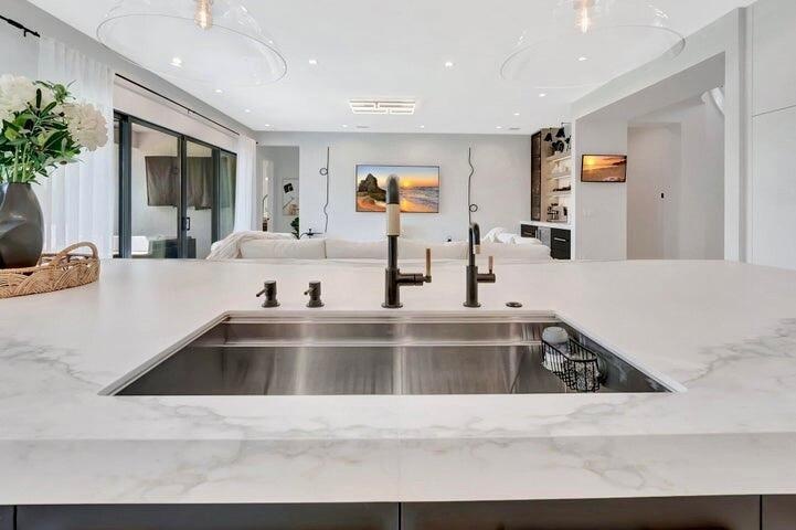 Alternate view of the custom sink with porcelain cover panels removed, revealing the full sink basin and functional design beneath.