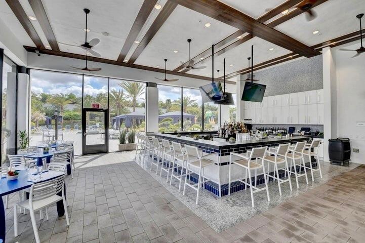 Covered outdoor lounge and dining area offering shaded seating and an inviting space to relax or entertain.