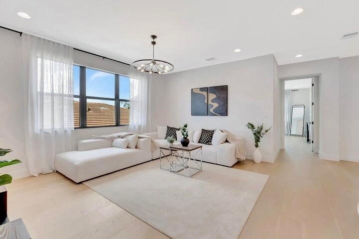 Additional angle of the upper-level loft showcasing the spacious design and connection to the main living areas below.