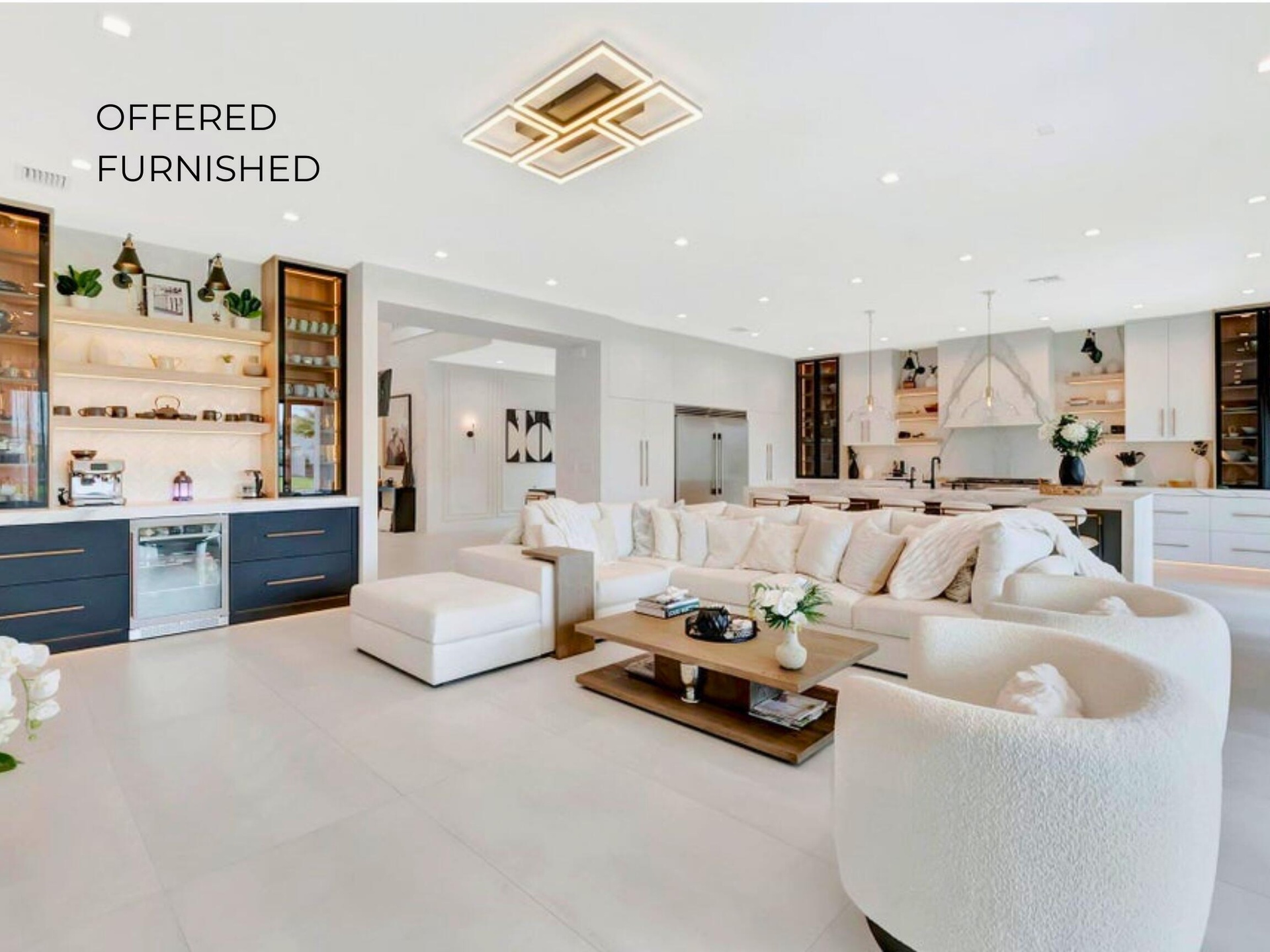 Spacious living area featuring clean modern finishes, recessed lighting, and seamless flow to the kitchen and dining spaces.