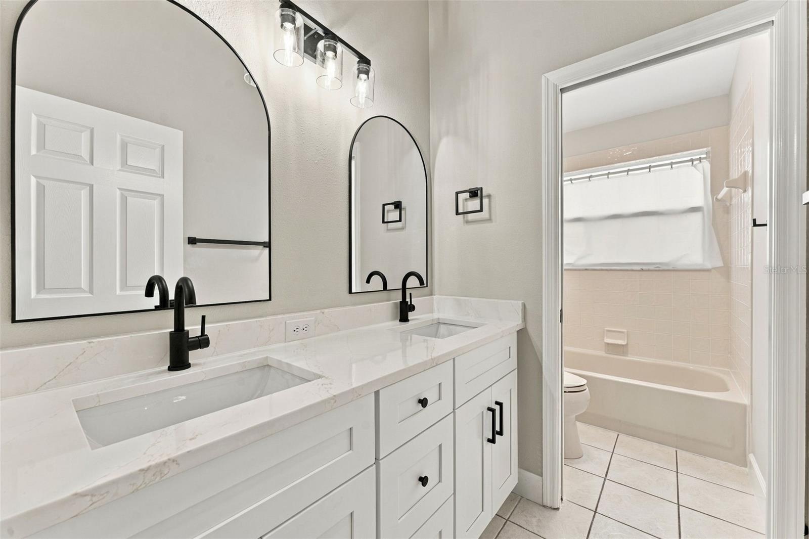 Hall bathroom upstairs with new dual vanity, lighting, mirrors & fixtures
