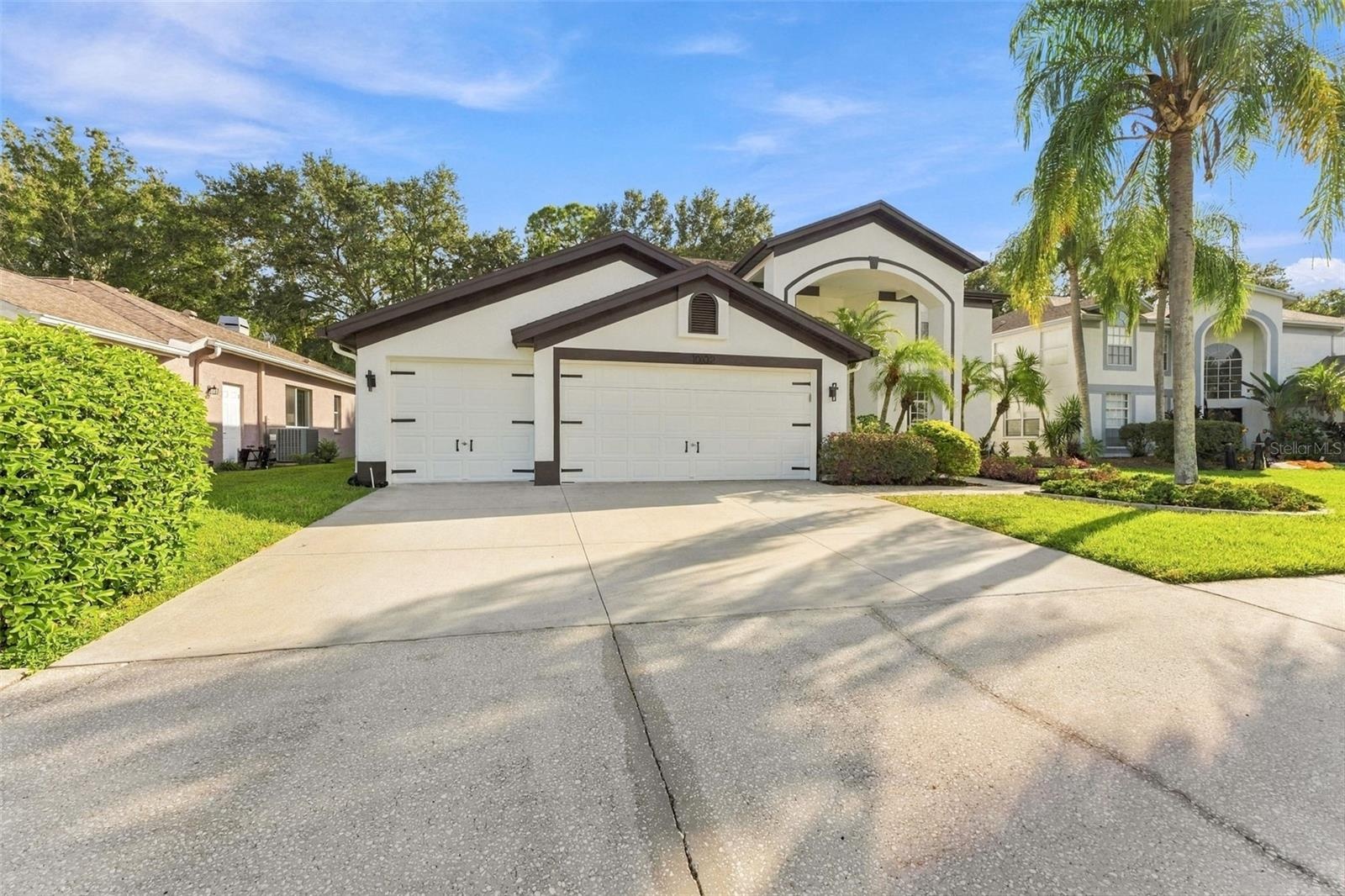 3 car garage with large parking pad