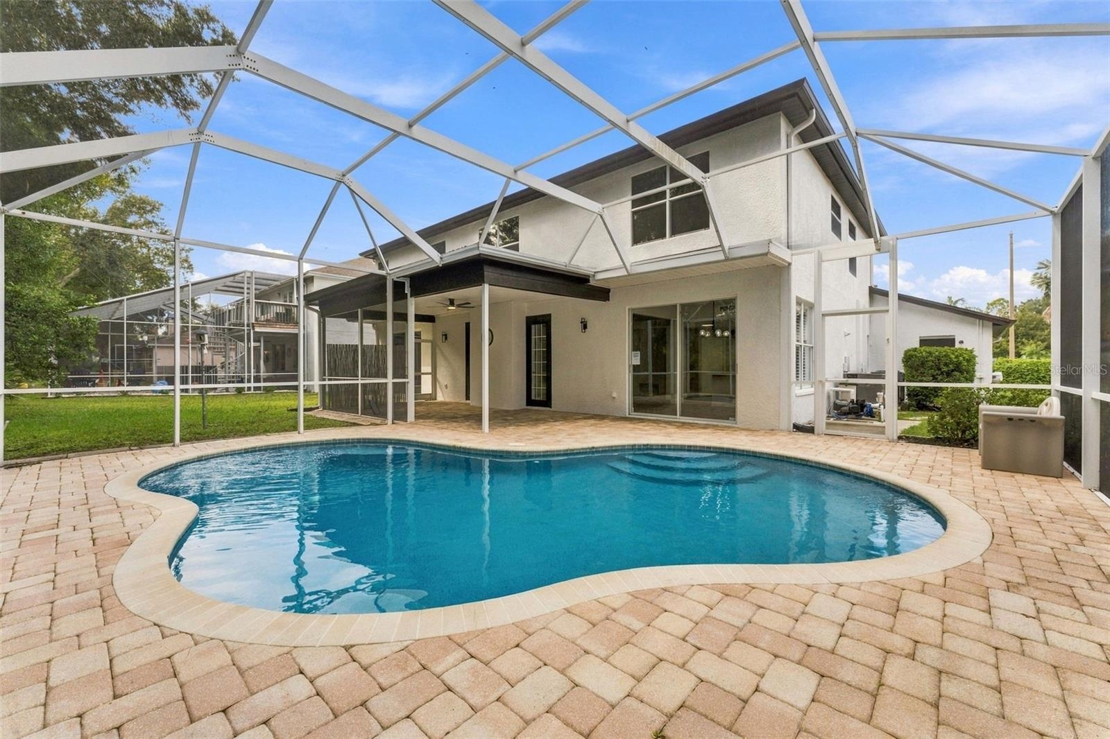 Beautiful pool area with paver deck