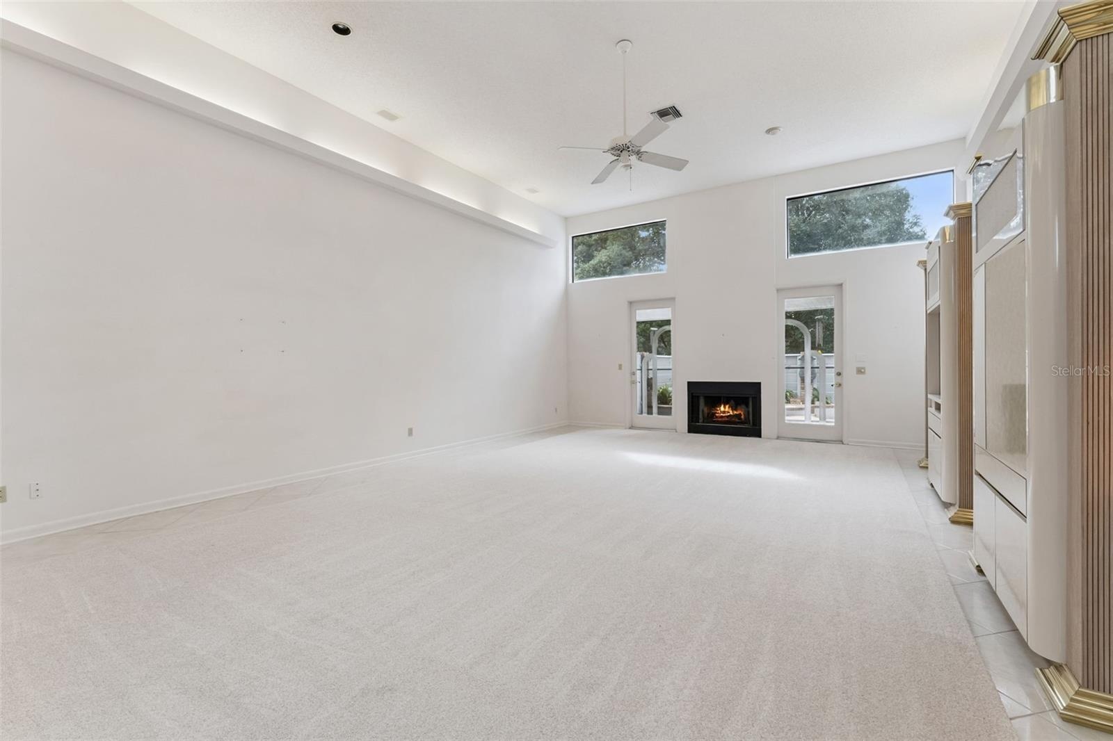 Living and dining room with wood burning fire place