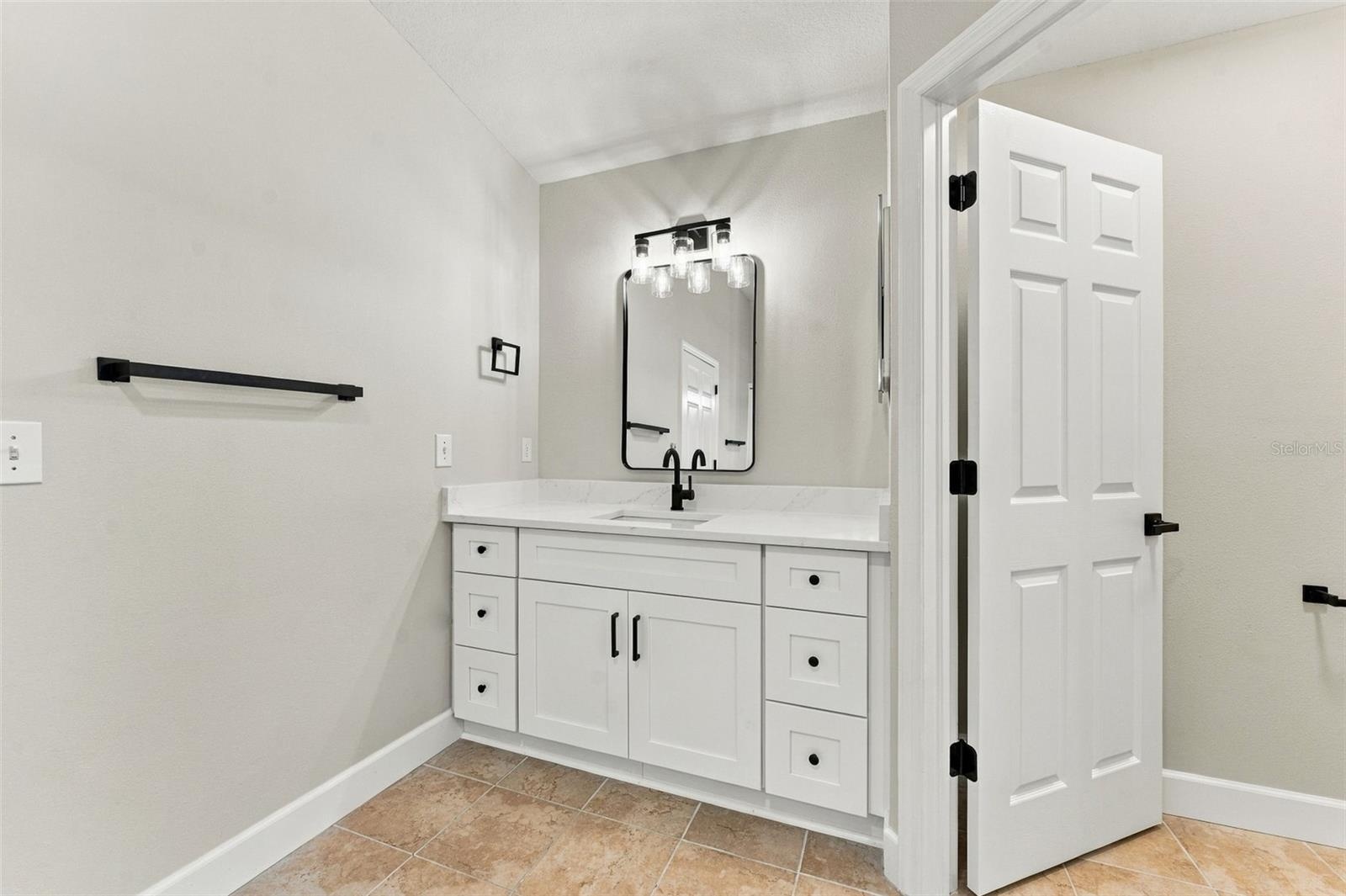 All new fixtures, finishes & vanities in this primary bathroom