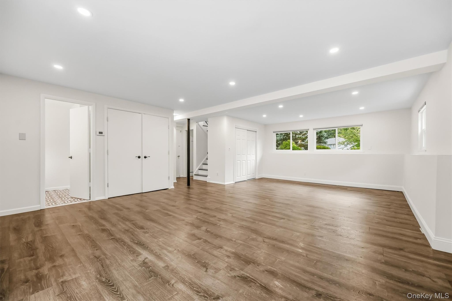 Large family room with full bath, bedroom & slider to covered patio