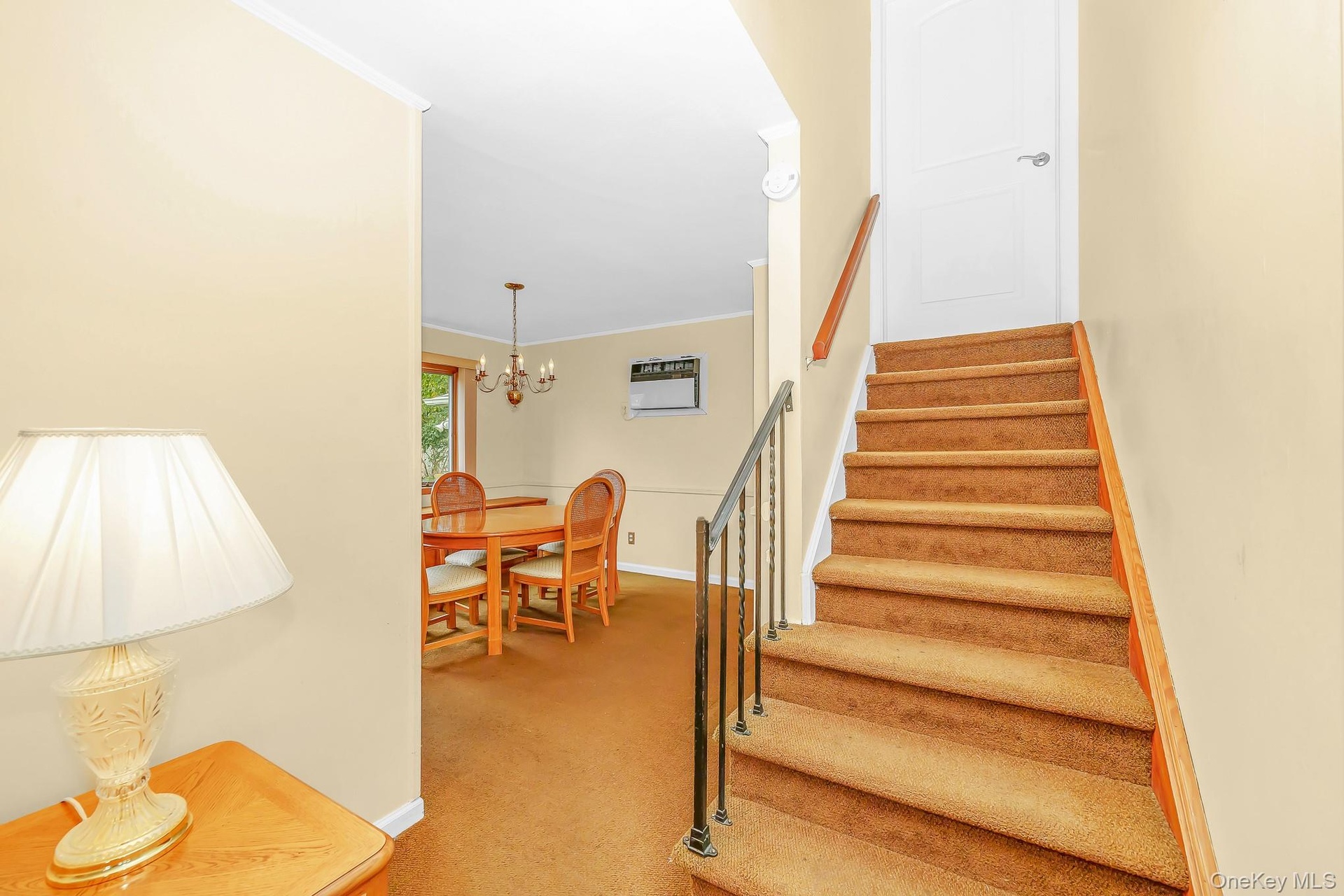 Stairs go up to bedroom