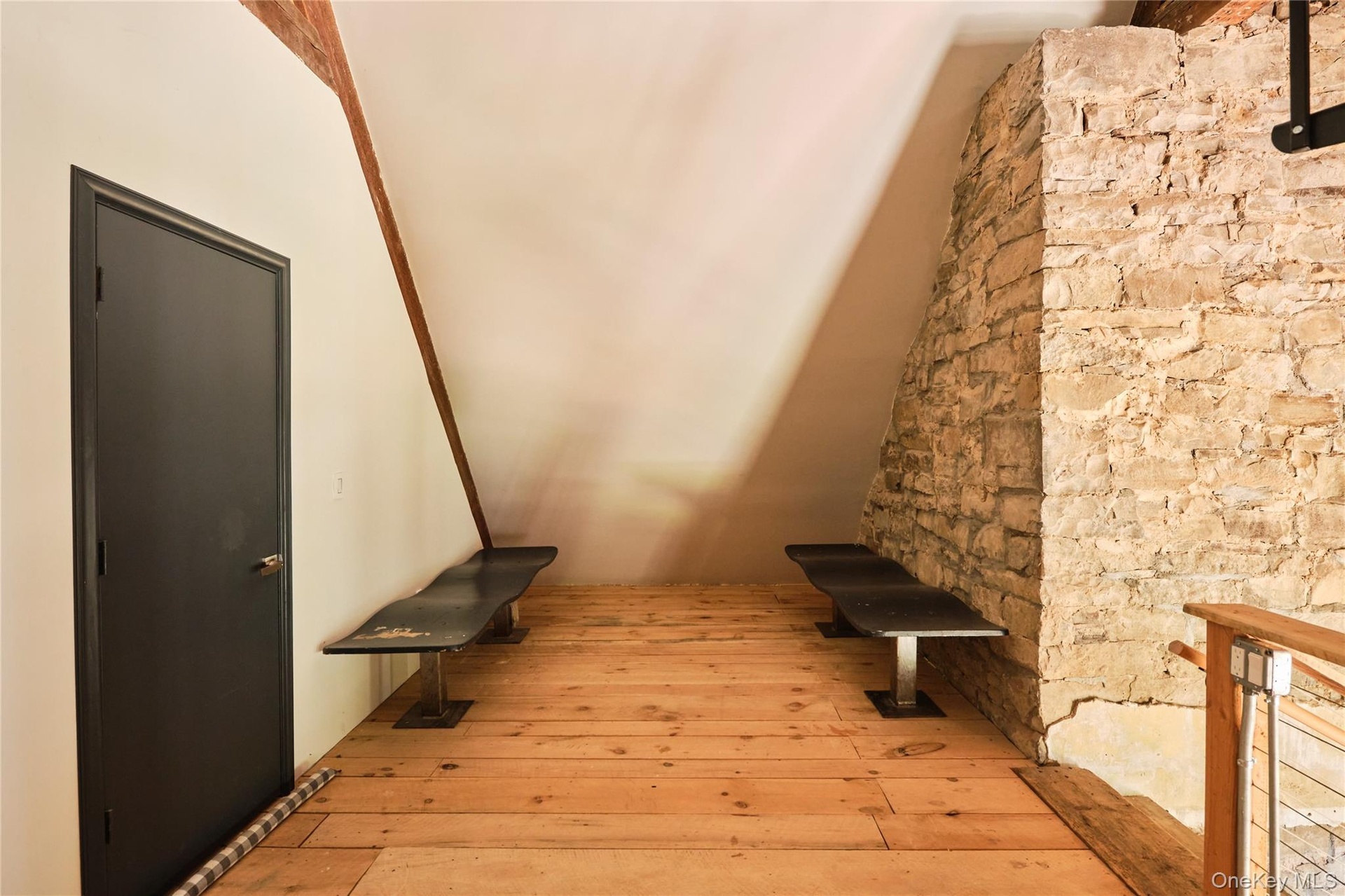 Stairway featuring hardwood / wood-style flooring