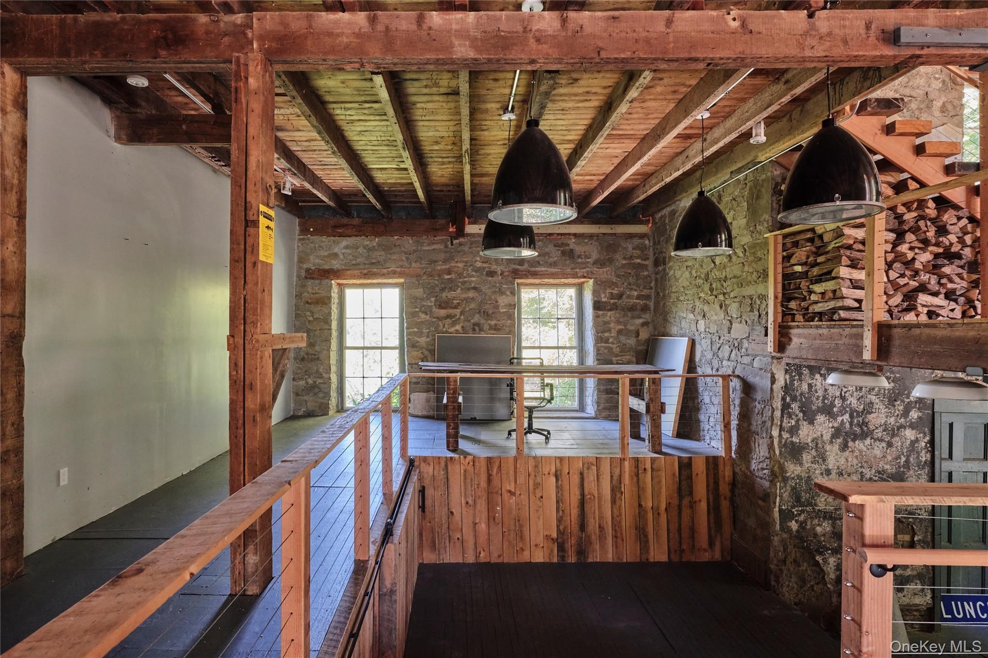 Hallway featuring a wood ceiling with exposed beams, an upstairs landing, and dark wood finished floors