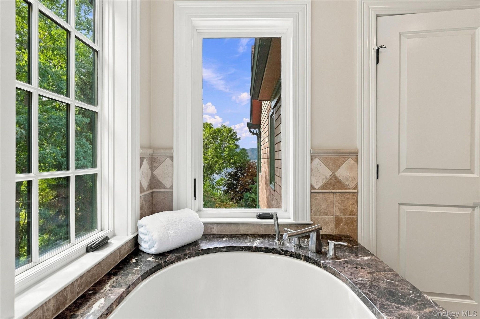 An oversized 80-gallon air therapy tub perfectly positioned to capture stunning views, creating a serene and spa-like retreat.