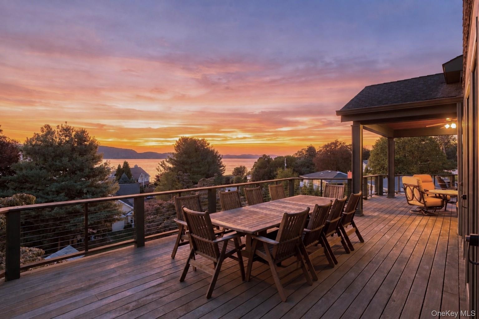An expansive Ipe wood deck offering a front-row seat to spectacular Hudson River sunsets. With generous dining and lounging areas, this extraordinary 