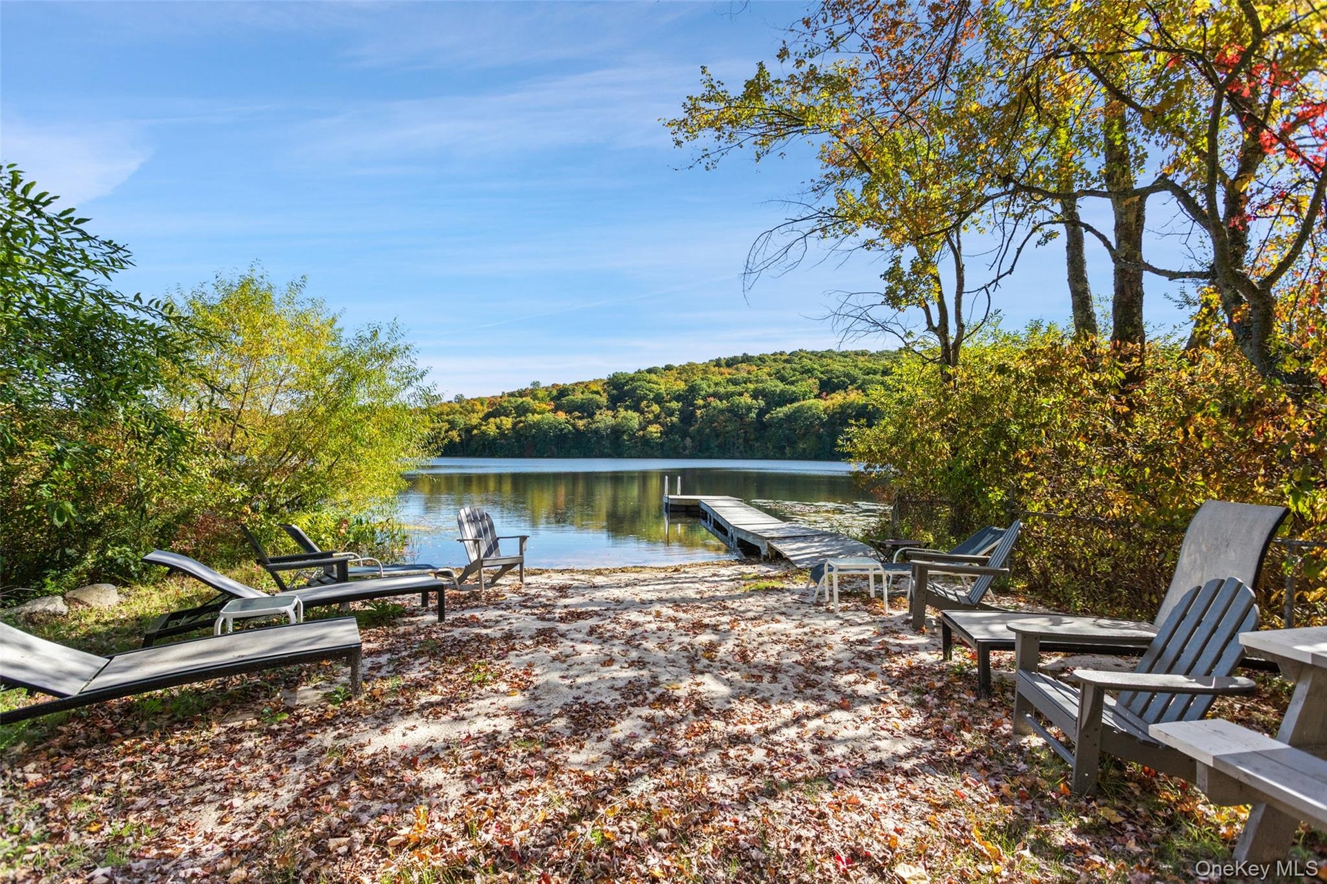 Sandy beach and sitting area on the water